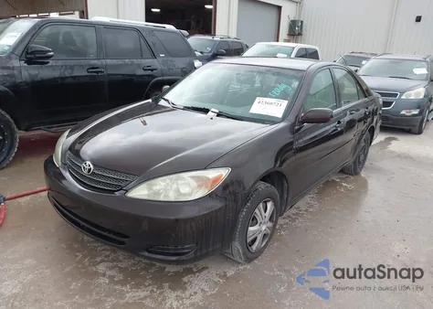 2002 Toyota Camry Le z USA, uszkodzony, nr VIN JTDBE32K720119418
